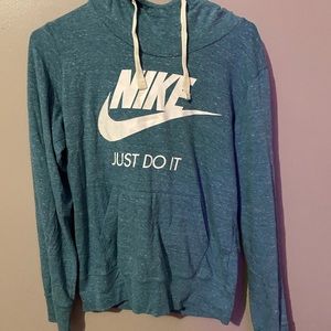Nike medium bluish long sleeved hooded shirt
